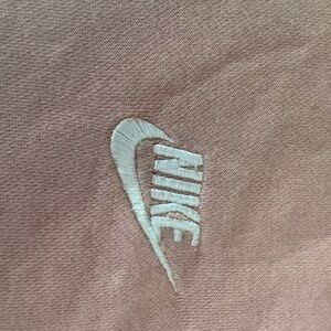 2 Nike Sweatshirts. Pink: Size M. Black: Size L.